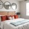a bedroom with a bed and lamps