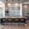 a kitchen with a bar and chairs