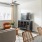 a living room with a tv and couches