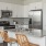 a kitchen with white cabinets
