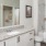 a bathroom with a large mirror