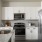 a kitchen with white cabinets