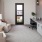 a room with a desk and chairs